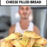 niko holding a plate of cypriot flaounes ready to be eaten