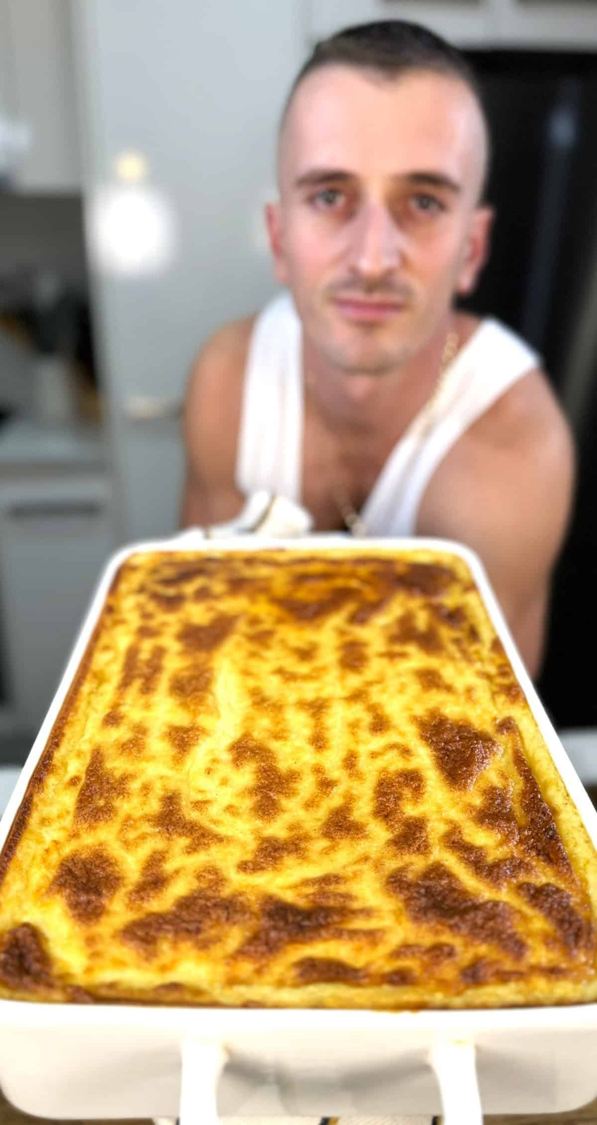 niko holding pastitsio in tray