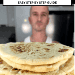 niko holding stack of greek pita bread