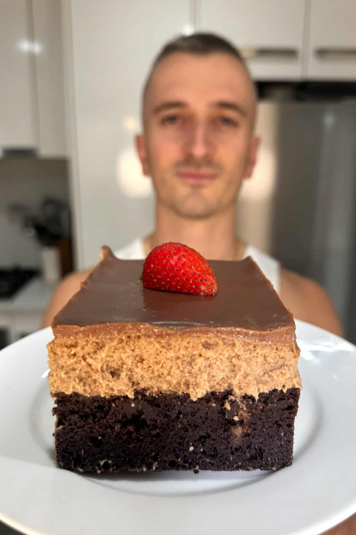 niko holding a slice of pasta sokolatina 