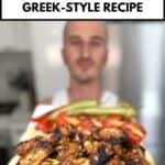 niko holding plate of greek chicken wings ready for eating