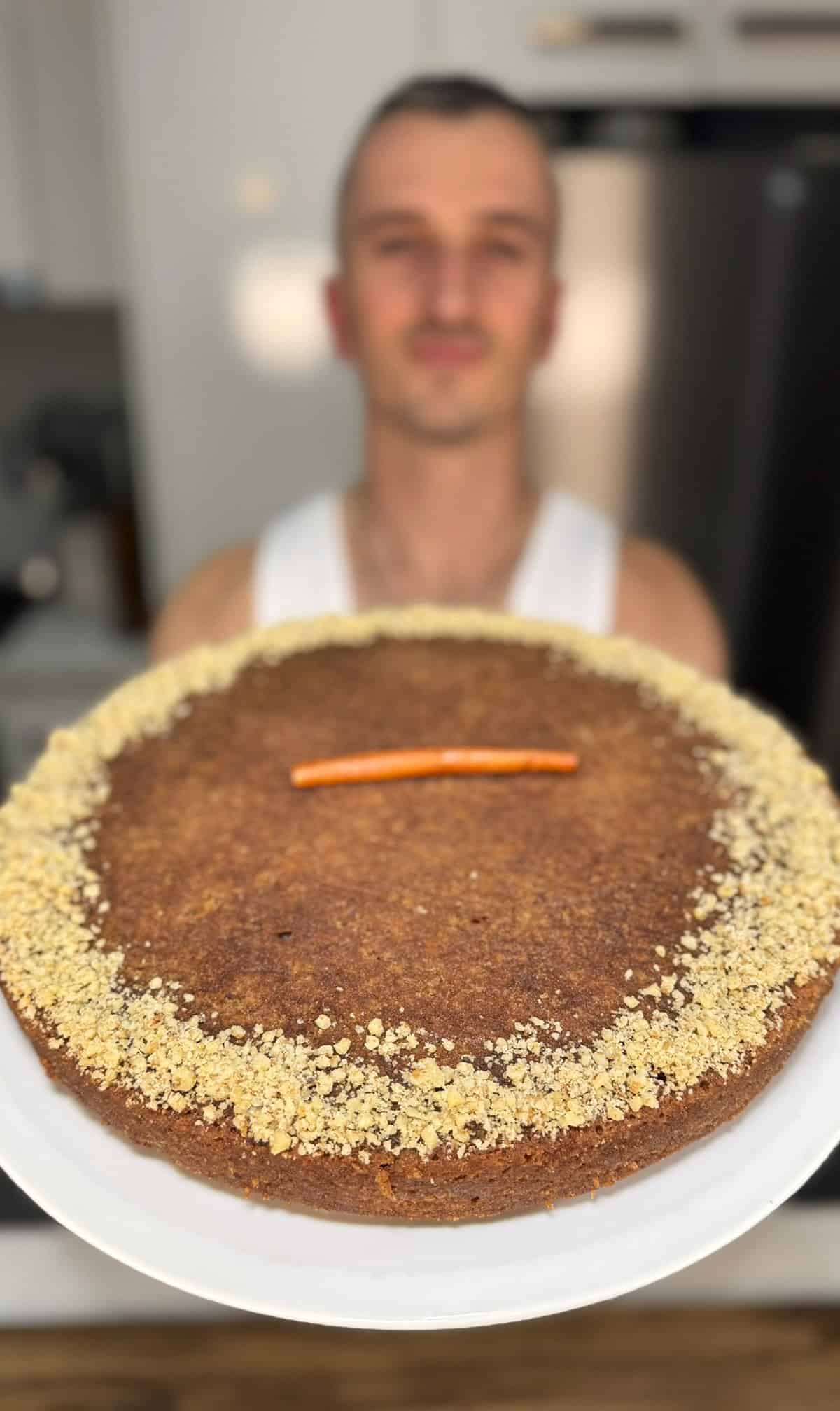 niko holding a baked karidopita ready for serving